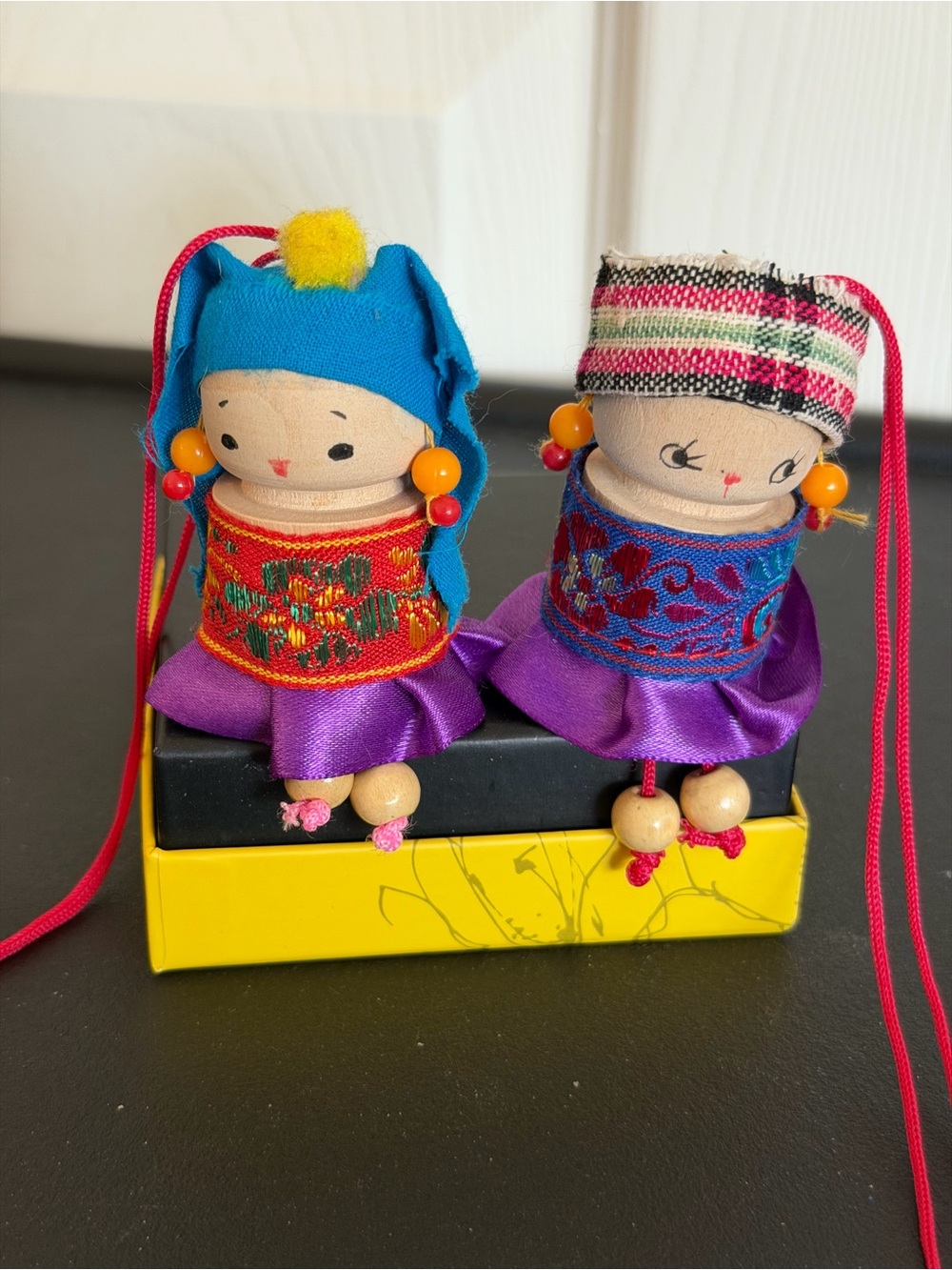 Vintage Asian souvenir wooden spool/peg dolls for decor. Dangle legs.